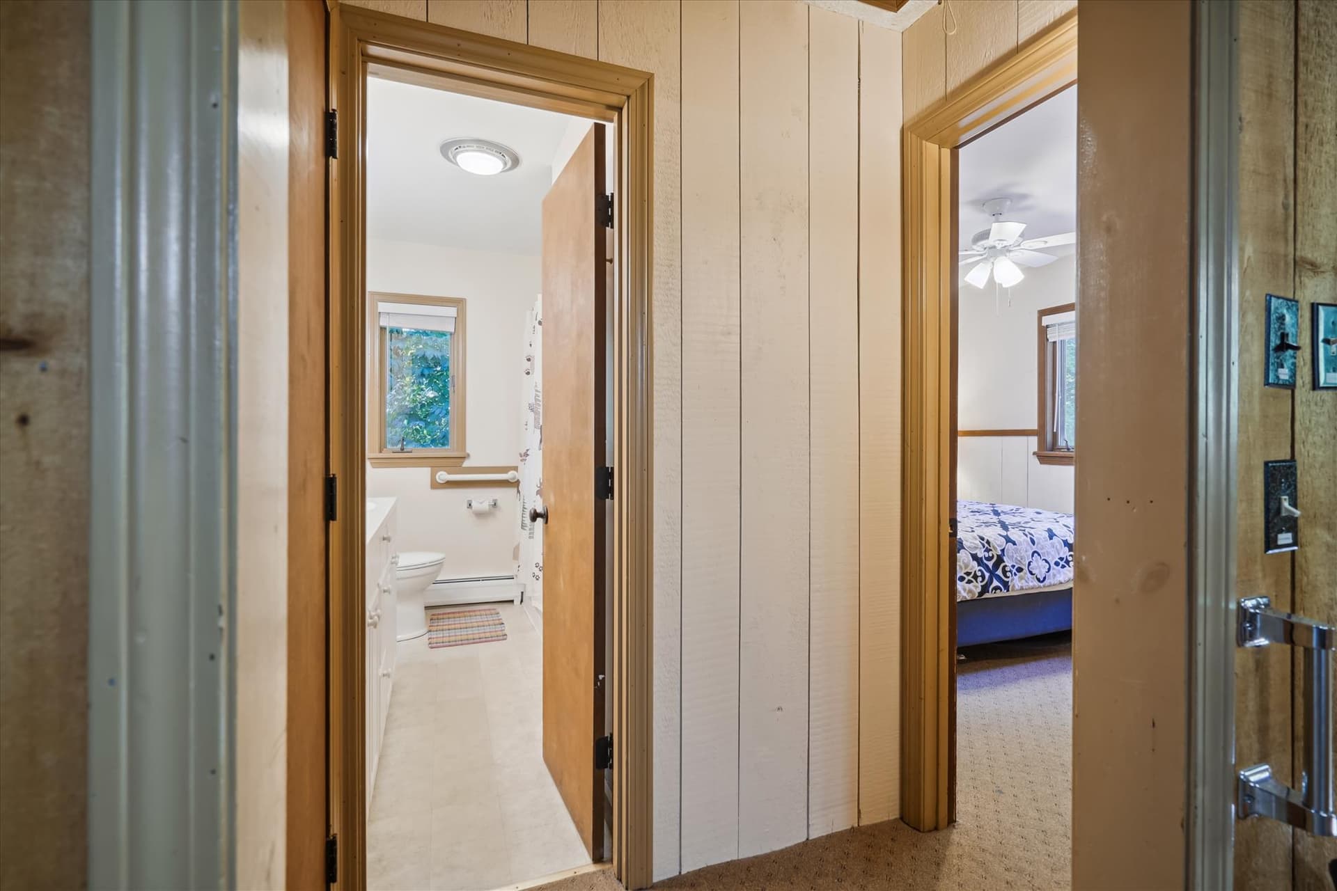 Entrance to master bedroom and full bathroom from the main living space, upper level