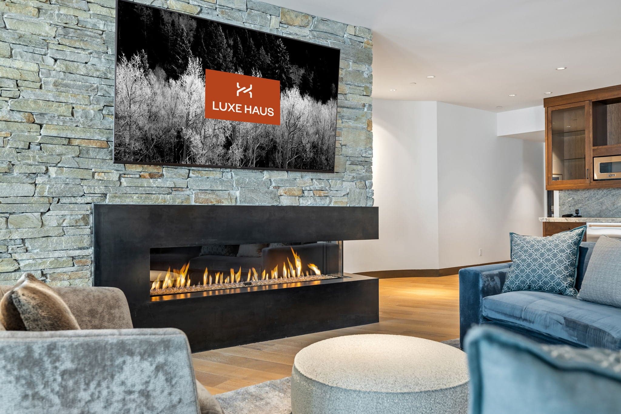 A close up view of a fireplace with a seating area.