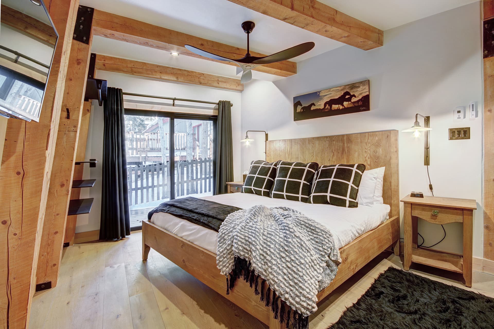 Main level primary suite with King-size bed, private deck, flat screen TV, and private bath - Arrow Darrow Breckenridge Vacation Rental