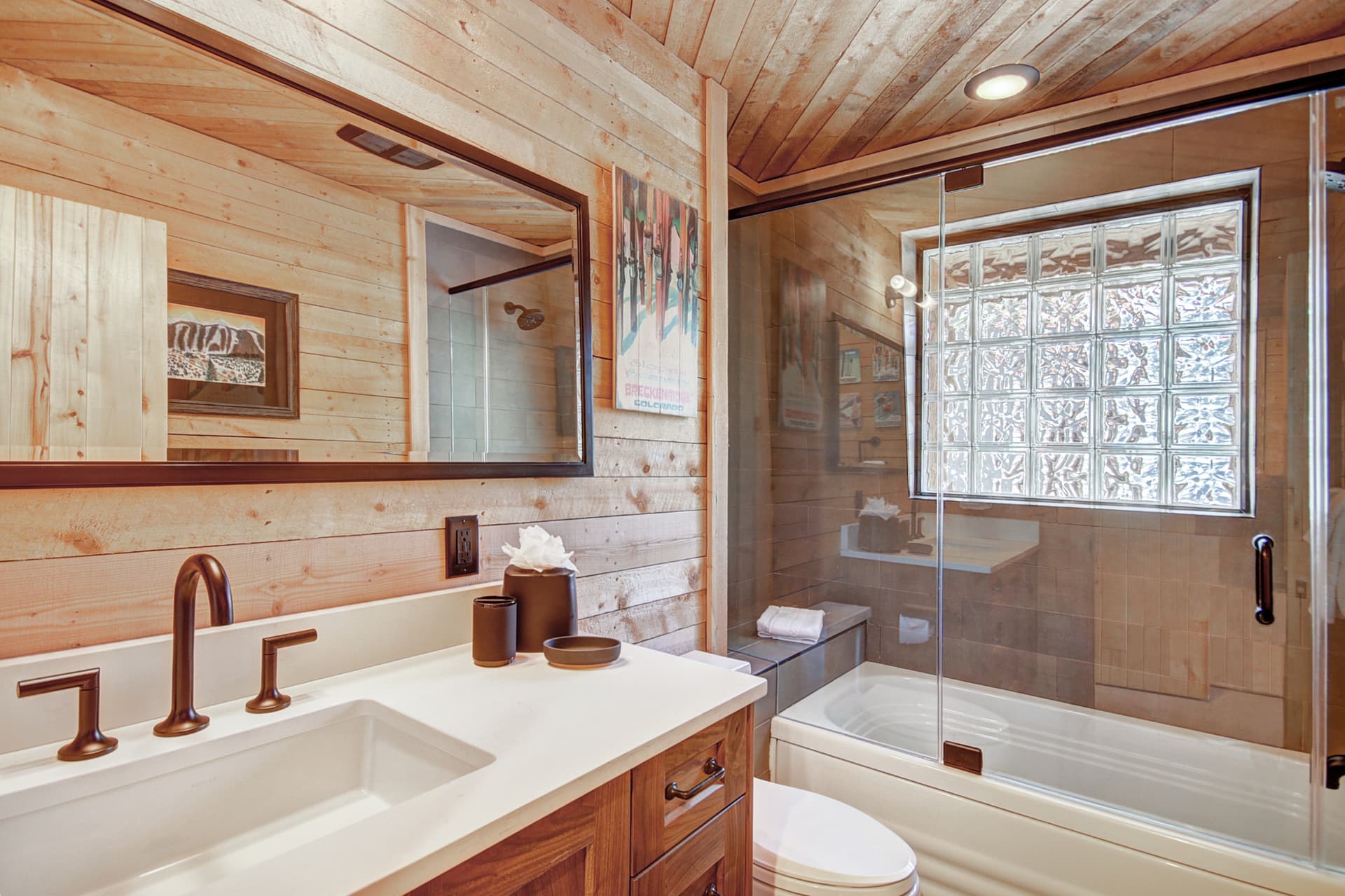 Upper level primary suite private bath with bathtub/shower combination and 1 sink - Arrow Darrow Breckenridge Vacation Rental