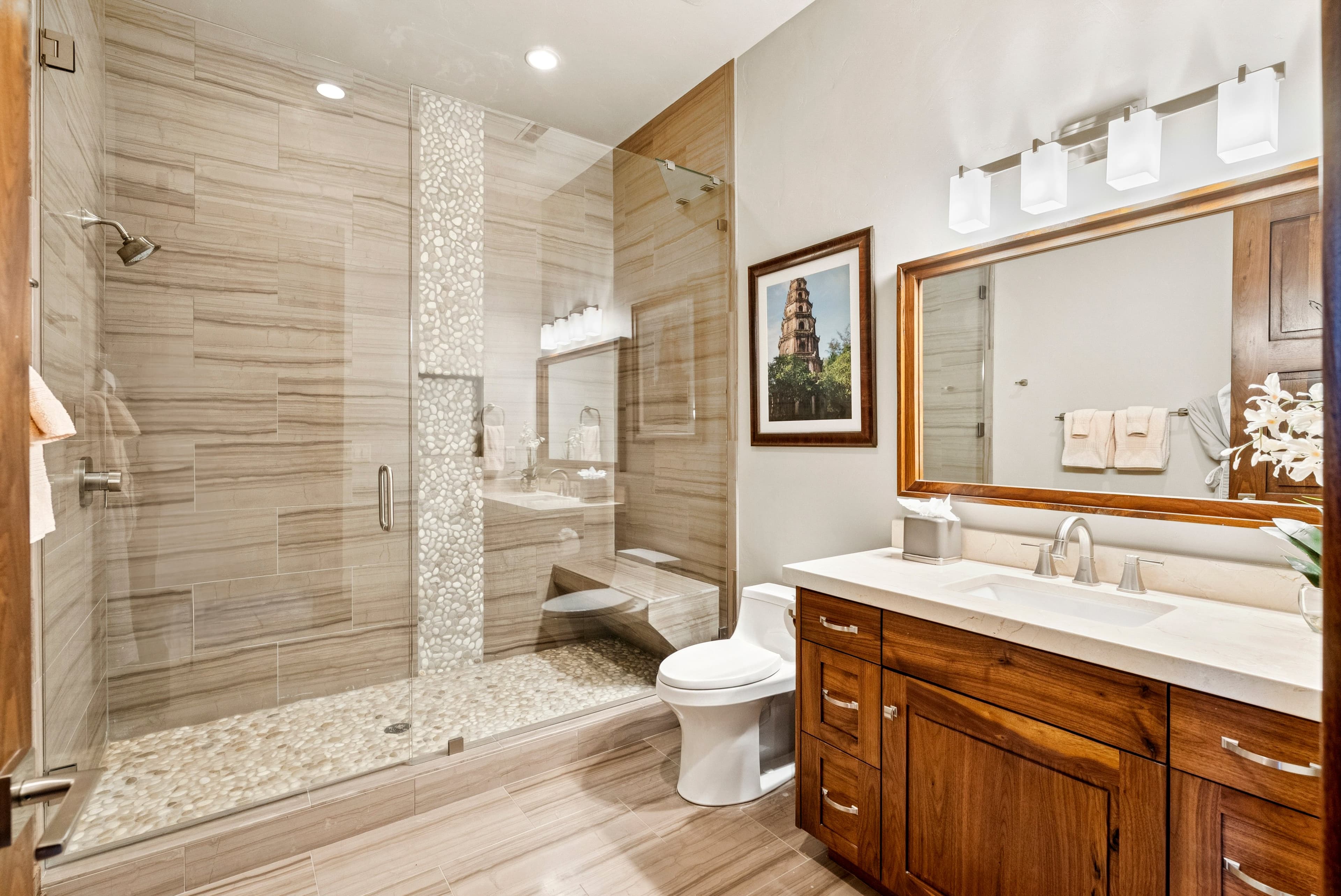 guest suite with large modern shower and sink vanity